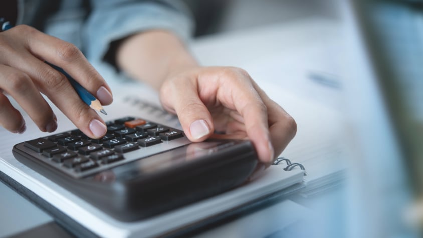 A man using a calculator