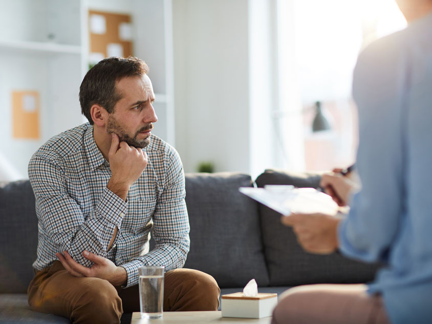 A man receives help from a mental health professinal