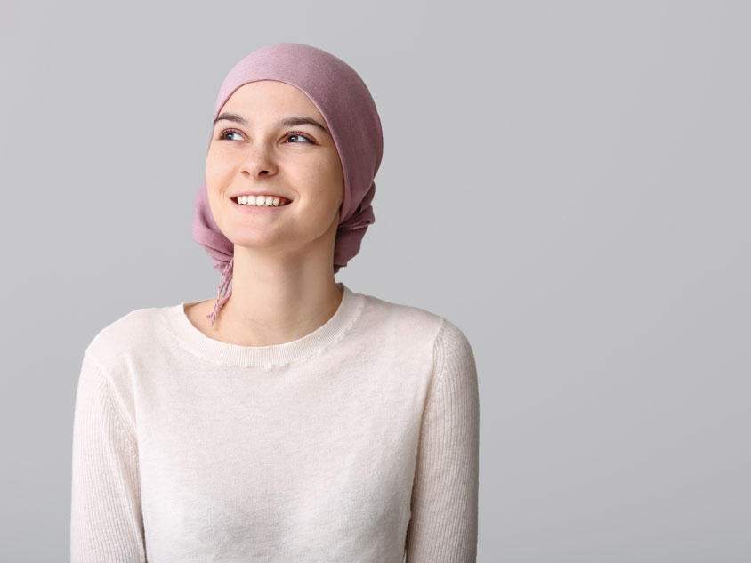 A woman wearing a headscarfe