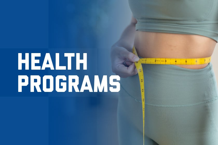 A woman measuring her waist