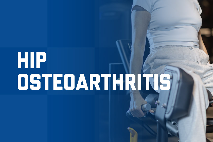 Woman performing hip strengthening exercises at gym