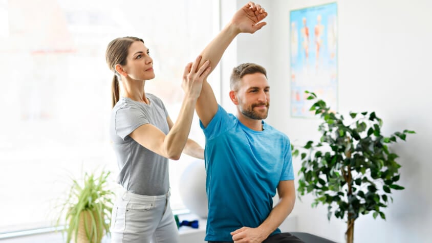A man receives treatment from a health professional